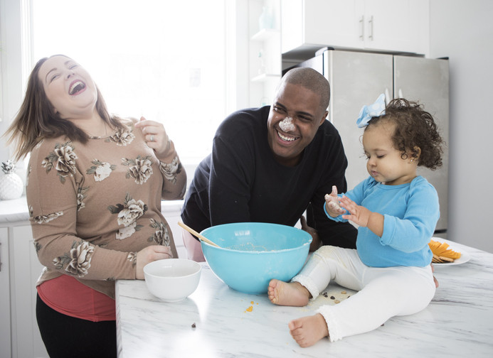 happy family cooking together in kitchen